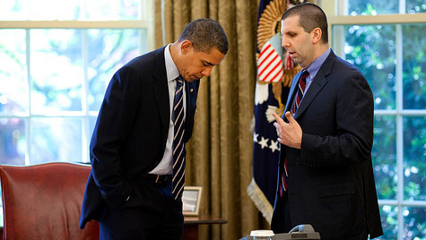 Obama notices a stain on his tie in the Oval Office