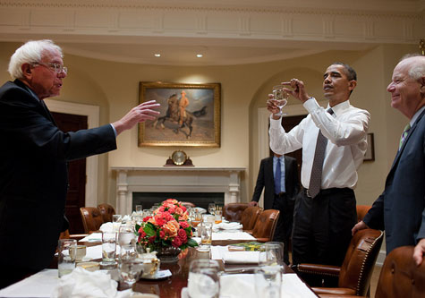 Obama holding a glass of water 